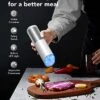 Gravity Electric Salt And Pepper Grinder Set Battery Operated, Adjustable Coarseness, Blue LED Light, One Hand Automatic Operation, Stainless Steel Classic Black & White, 2 Mills