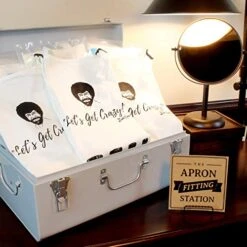 Bob Ross Apron | Perfect For Women, Men, And Kids | Features Paint Brush Pockets | White Canvas 100% Cotton Material | Great For Painting And Cooking | Unique Gift For Art Enthusiasts | Comfortable -Peugeot Shop 51CB1XLyyuL