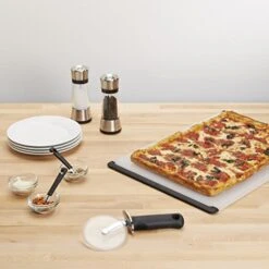 OXO 1065872 Good Grips 4-inch Pizza Wheel And Cutter For Non-Stick Pans,Clear/Black -Peugeot Shop 51aFNKwSMxL